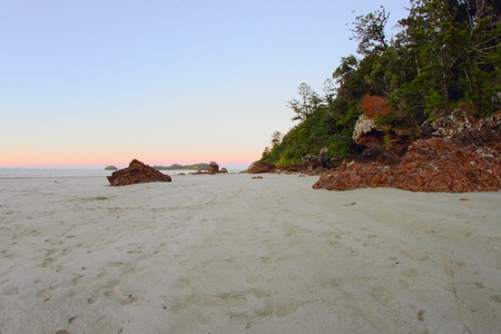 volcanic craggy rock beach with norfolk background Hillsborough national park queensland australiaの写真素材