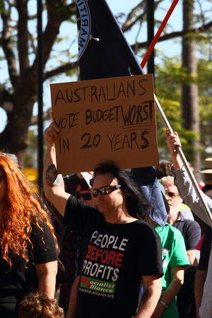 BRISBANE, AUSTRALIA - JULY 06 : Unidentified protester anti budget with sign at Bust The Budget anti liberal governement Rally July 06, 2014 in Brisbane, Australiaのeditorial素材