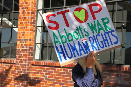 BRISBANE, AUSTRALIA - JULY 12 : Unidentified protester with anti refugee policy sign outside Liberal National Party national conerfence July 12, 2014 in Brisbane, Australiaのeditorial素材