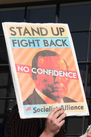 BRISBANE, AUSTRALIA - JULY 12 : Unidentified protester with anti Abbott sign outside Liberal...