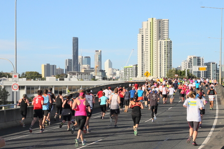BRISBANE, AUSTRALIA - SEPTEMBER 07 : Unidentified runners  participating in the "Bridge to Brisbane" charity fun run on September 07, 2014 in Brisbane, Australiaのeditorial素材