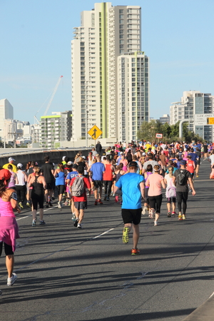 BRISBANE, AUSTRALIA - SEPTEMBER 07 : Unidentified runners  participating in the "Bridge to Brisbane" charity fun run on September 07, 2014 in Brisbane, Australiaのeditorial素材