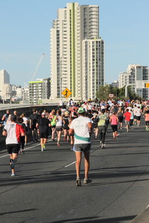 BRISBANE, AUSTRALIA - SEPTEMBER 07 : Unidentified runners  participating in the "Bridge to Brisbane" charity fun run on September 07, 2014 in Brisbane, Australiaのeditorial素材