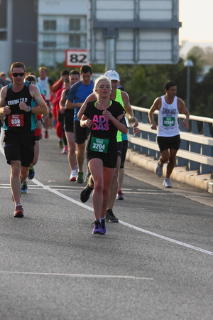 BRISBANE, AUSTRALIA - SEPTEMBER 07 : Unidentified runners  participating in the "Bridge to Brisbane" charity fun run on September 07, 2014 in Brisbane, Australiaのeditorial素材