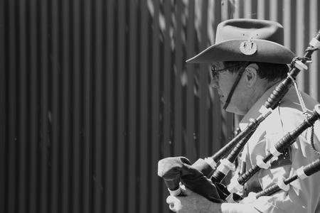 CABOOLTURE, AUSTRALIA -SEPTEMBER 06: Unidentified bagpiper as part of ANZAC centenary commemoration at historical village September 06, 2014 in Caboolture, Australiaのeditorial素材