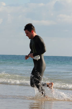 MOOLOOLABA, AUSTRALIA - SEPTEMBER 14 : Unidentified competitor in the "Ironman 70.3" triathlon on September 14, 2014 in Mooloolaba, Australiaのeditorial素材