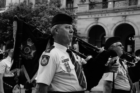 BRISBANE, AUSTRALIA - APRIL 25 : Police band playing on march during Anzac day centenary commemorations April 25, 2015 in Brisbane, Australiaのeditorial素材