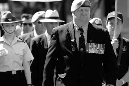 BRISBANE, AUSTRALIA - APRIL 25 : Veterans march along the route during Anzac day centenary commemorations April 25, 2015 in Brisbane, Australiaのeditorial素材