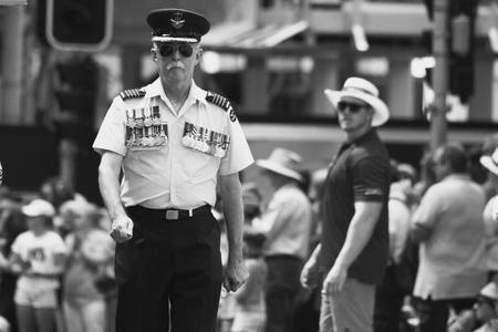 BRISBANE, AUSTRALIA - APRIL 25 : Airforce officer heavily adorned with medals marches  during Anzac day centenary commemorations April 25, 2015 in Brisbane, Australiaのeditorial素材