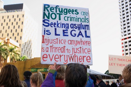 BRISBANE, AUSTRALIA - JUNE 20: Rally goer holding anti- immigration policy at World Refugee Day Rally June 20, 2015 in Brisbane, Australiaのeditorial素材