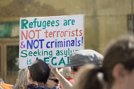 BRISBANE, AUSTRALIA - JUNE 20: Rally goer holding anti- immigration policy at World Refugee Day Rally June 20, 2015 in Brisbane, Australiaのeditorial素材