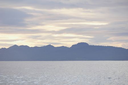 freycinet national park silhouetted  from spiky beach swansea tasmaniaの写真素材