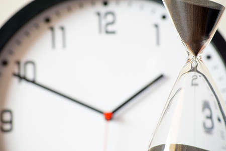 Hour glass and clock concept for time missed important deadline, schedule and deadline.