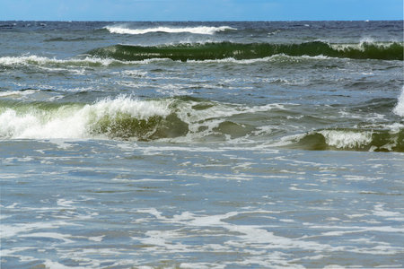 Horizontal photo of waves in the sea during a storm.の写真素材