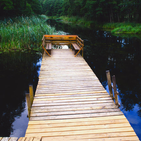Square photo of a small pier on an ecological riverの写真素材