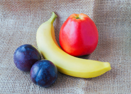 Horizontal shots of ripe fresh fruit lying on the tableの写真素材