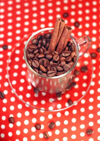 coffee beans in a glass cup with cinnamon, close-upの写真素材