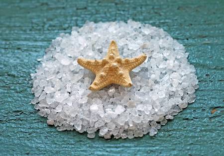 sea salt with starfish on wooden background, close-upの写真素材