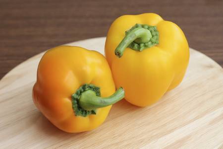Bell peppers on wooden background, close-up