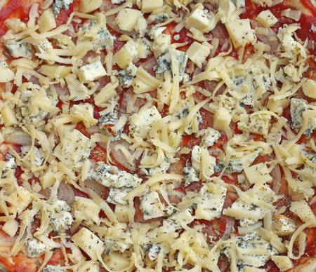 unbaked pizza with cheese, close-up