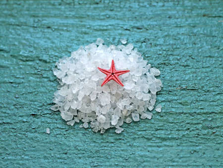 sea salt with starfish on wooden background, close-upの写真素材