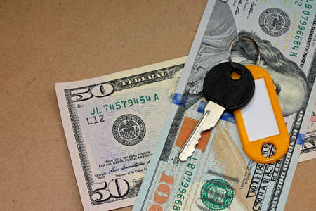 Idea of rental housing. Key with dollars