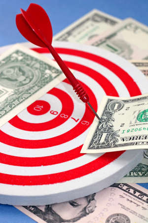 Idea of ââmaking profit - dart hit at dollar, close-upの写真素材