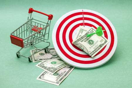 Shopping as goal. Photo concept on green backgroundの写真素材