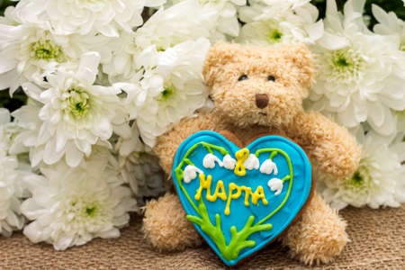 Image of gifts for March 8 - teddy bear, gingerbread and flowers