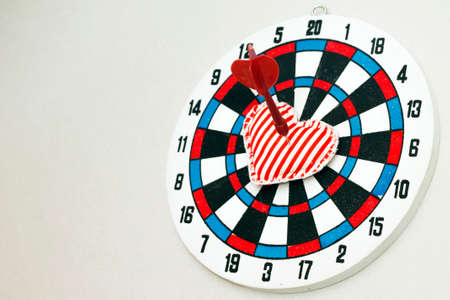 Love as aim on dartboard. Concept image, on gray backdropの写真素材