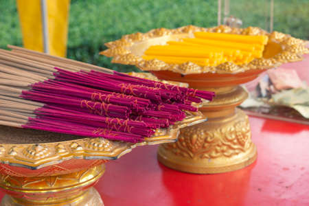 Praying offering - candles and flavored sticks. Thailandの写真素材