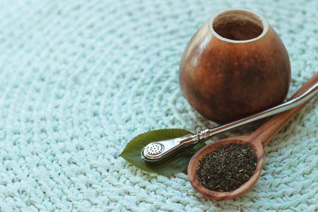 Photo of calabash with mate tea on knitted mat, close-upの写真素材