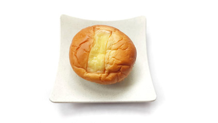 Close up of delicious double cheese bread on plate isolated on white background