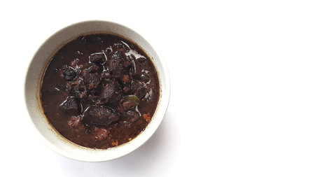 Black meat soup Rawon in a white bowlの写真素材