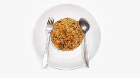 Seafood fried rice served on white plate isolated on white background. Food presentation businessの写真素材