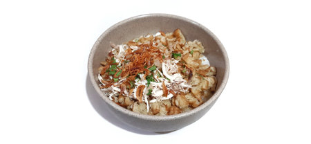 Rice porridge in a bowl isolated on a white background.