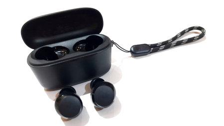 Black wireless bluetooth earbuds portable sound with fast charging case isolated on white background