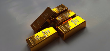 Pile of Shiny Gold Bullion Bars on Silver Background. Precious Metalの写真素材