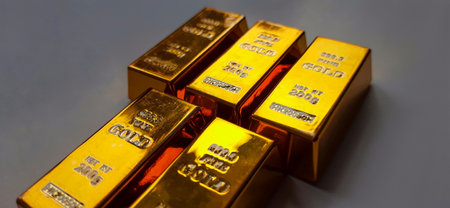 Gold bullion, close-up of gold ingots, macro shot on Gray Backgroundの写真素材