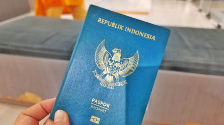 Bekasi, West Java, Indonesia - December 24 2025. Indonesian Passport Held in Hand, Ready for Travelのeditorial素材