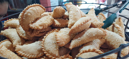 Close-up Jalangkote or Pastel Cake, Indonesian Fried Snack in a Basket. Street Food Photography
