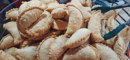 Pile of Jalangkote or Pastel Cake, Indonesian Fried Snack in a Basket. Street Food Photography