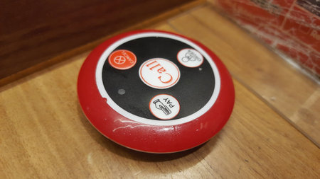 Restaurant Service Call Button on Wooden Table. Waiter Call Notification Convenience. Quick Service...