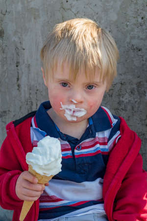 Young Boy Eating An Ice Creamの写真素材