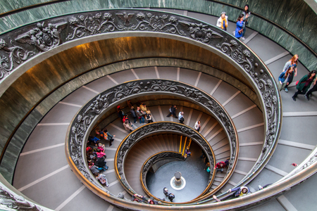 VATICAN CITY, VATICAN - MARCH 24 2014  Famous Spiral Stairs in the Vatican Museums with visitors on March 24 2014 in the Vatican in Italyのeditorial素材
