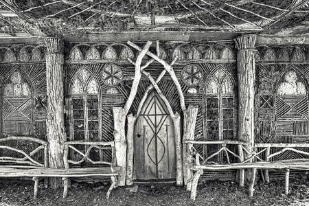 Old Wooden Chapel in the Woods. Winter Forest. Amazing wooden architecture in the black forest of Germany. Amazing winter imageの写真素材