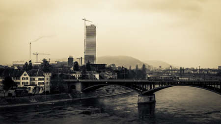Water Front at the Rhine river in the Swiss City of Basel. Historical Buildings on a snowy and cold winter day in Januaryの写真素材