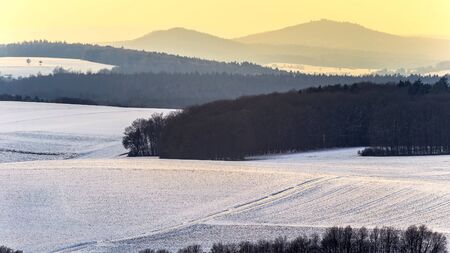 Cold snowy winter wonderland in the franconian Jura Region of Bavaria, Germany. Sweet Solitude. White and Lonely Landscapeの写真素材