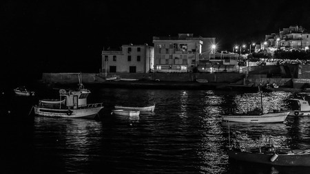 Lovely Picture of the Palermo coastline with boats at night on the beachの写真素材