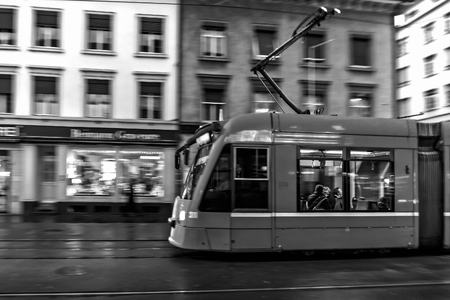 Tram in the swiss city of Basel in the evening on a cold and snowy winter day. Evening in Switzerlandのeditorial素材